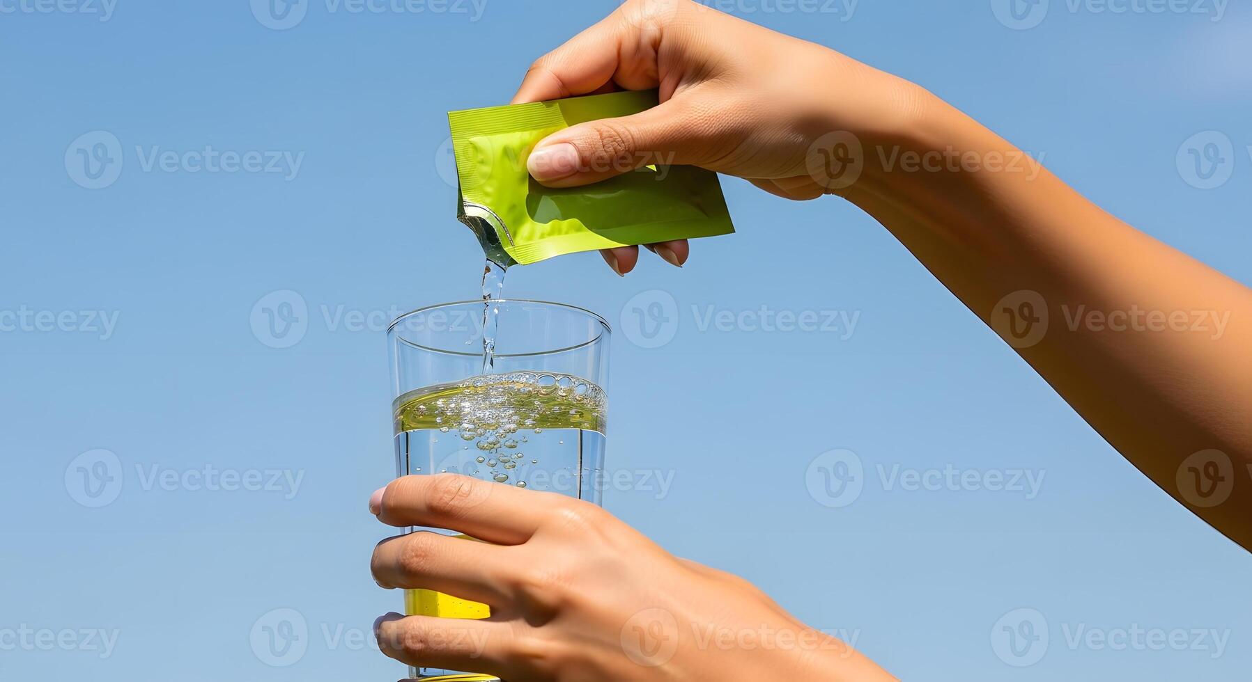 Electrolyte Powder Being Added to Water for Hydration, Refreshing Summer Drink on a Hot Day, Electrolytes Added to Drinking Water for Better Health photo