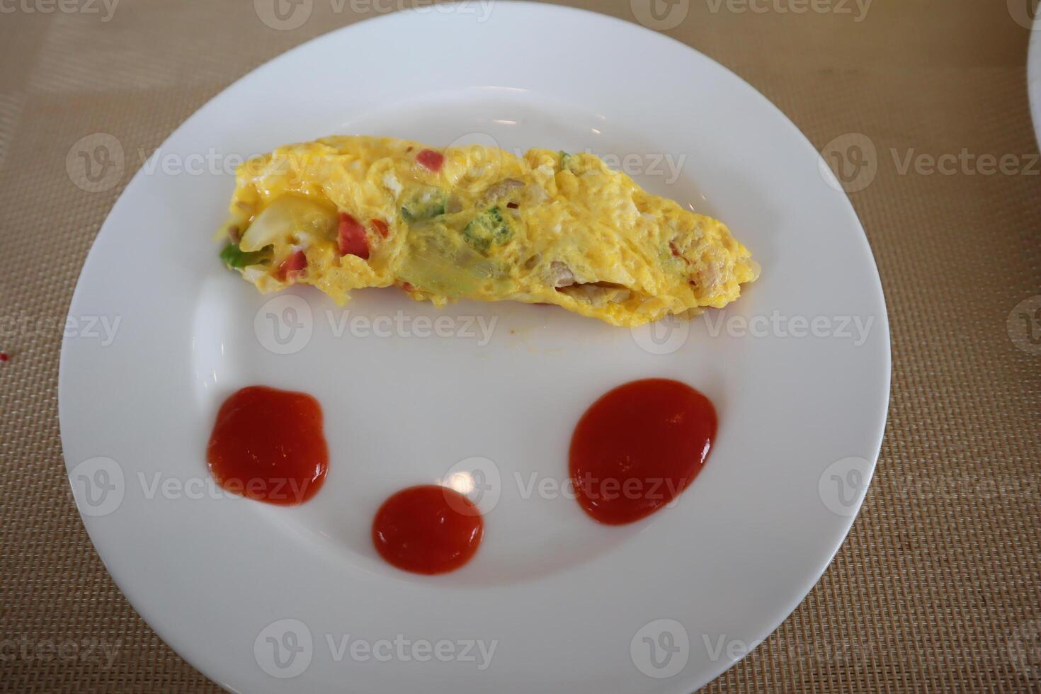 A plate with a face on it and ketchup on it photo