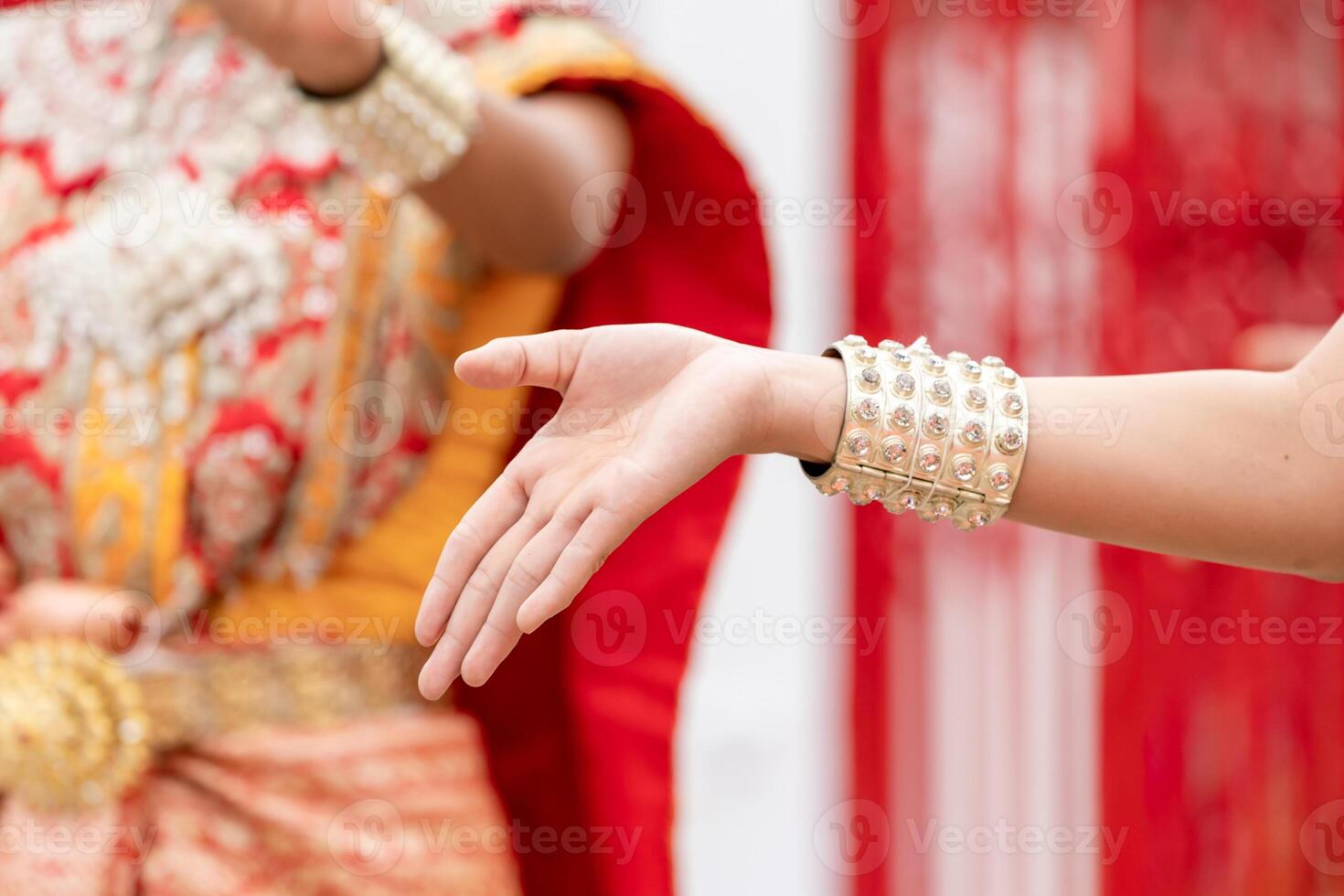 Close up hand of Thai folk dance during celebration on temple background. Thai traditional dance on event celebration.a photo