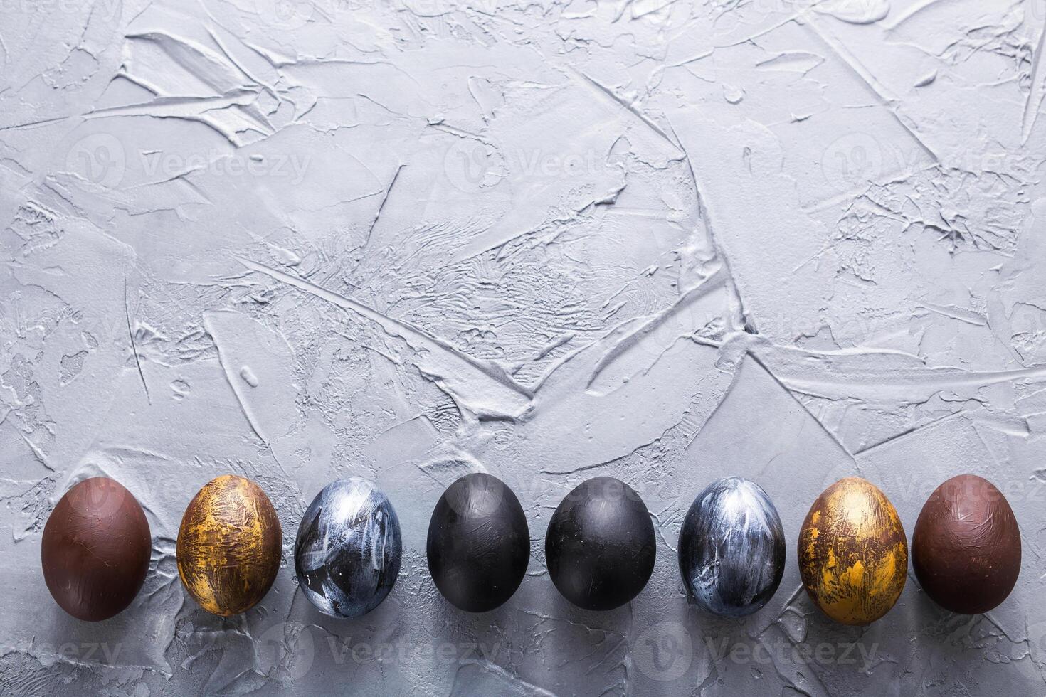 Holidays, design and modern easter concept. Black and brown easter eggs style minimalism on white background with copyspace. photo
