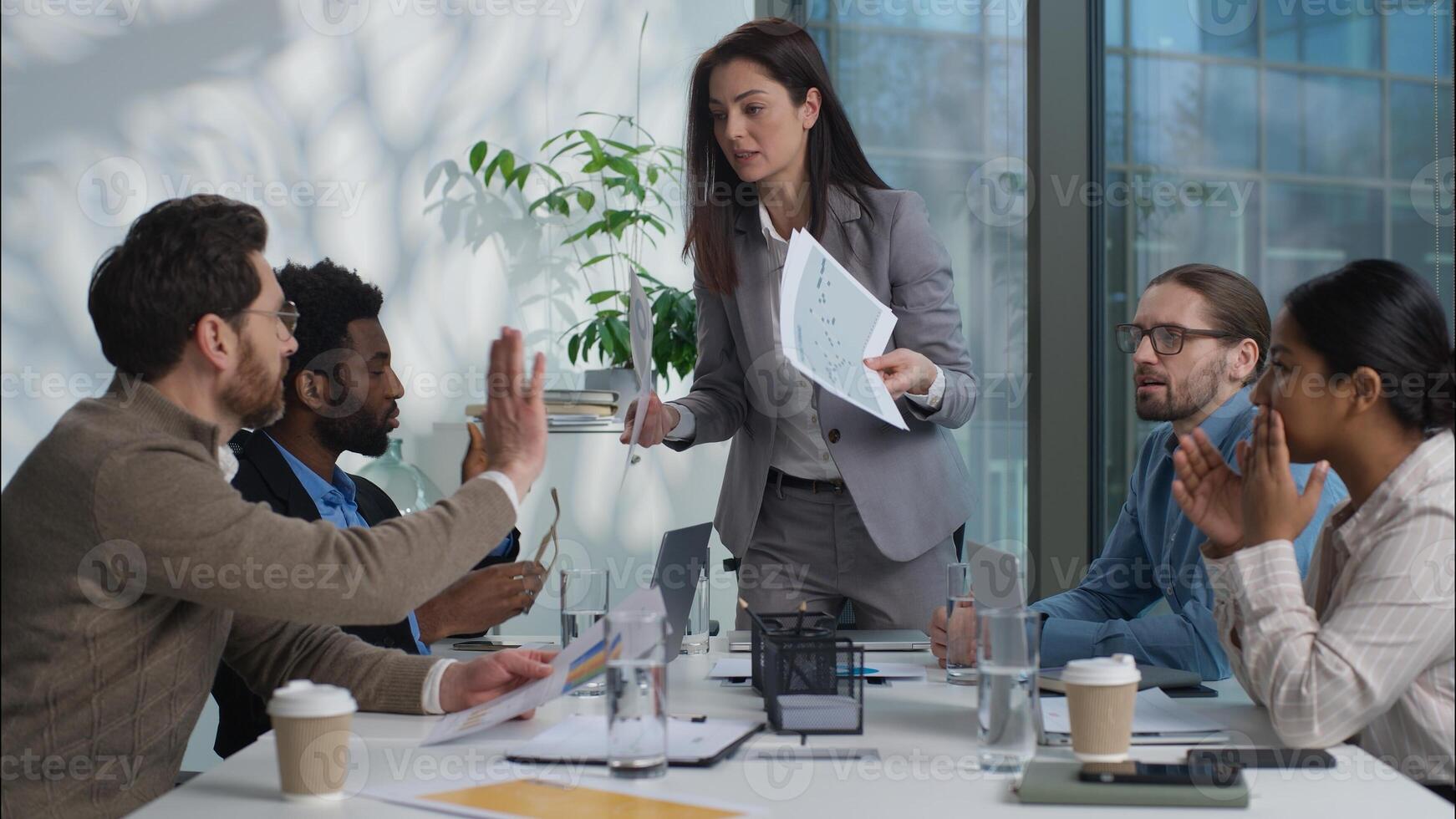 Multinational business team office businesswomen African businessmen argue angry leader Caucasian woman director boss shouting scream scold workers employers documents fail paperwork problem conflict photo