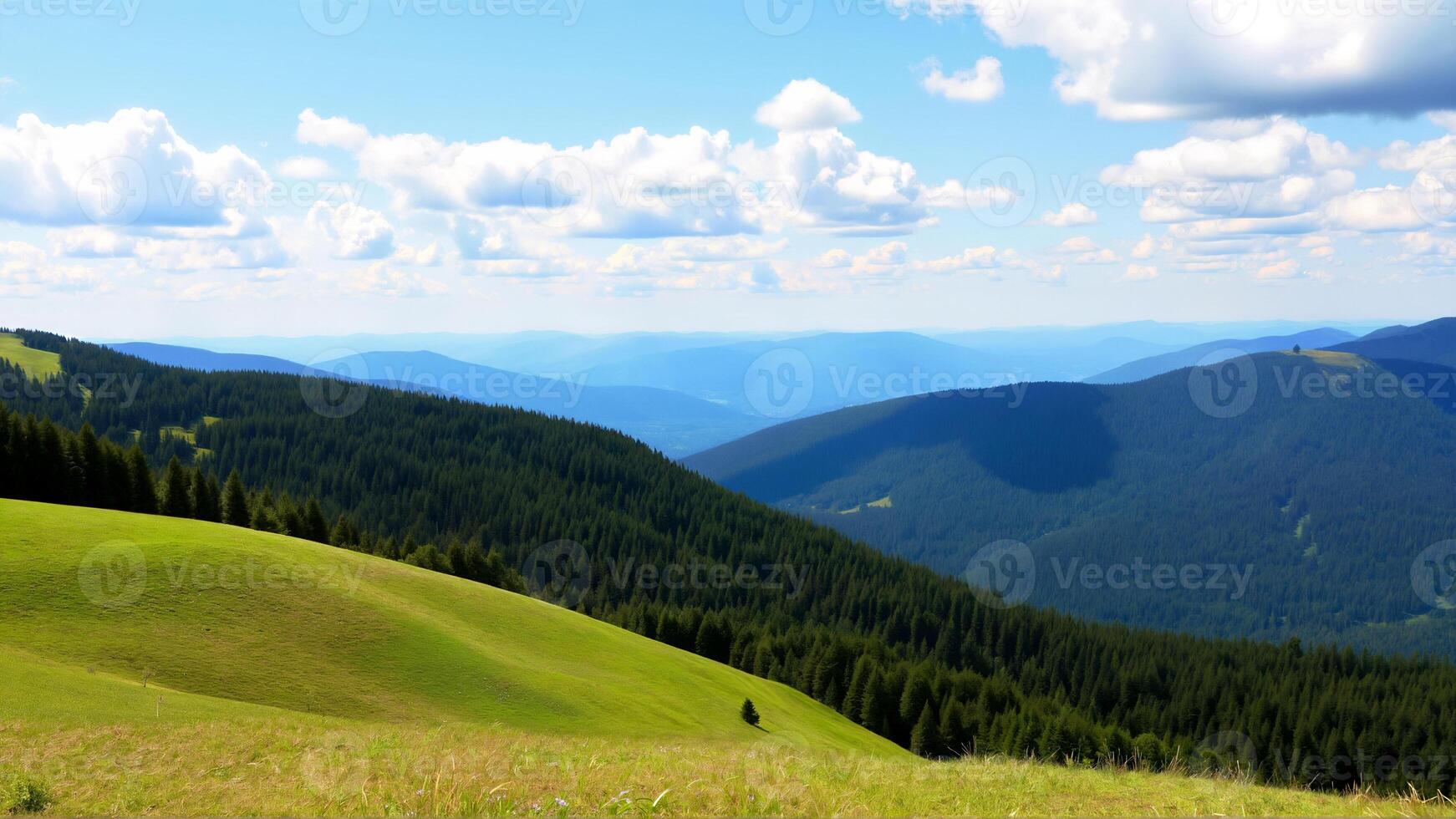 Breathtaking Landscape of Green Hills and Forested Mountains Under Blue Sky photo