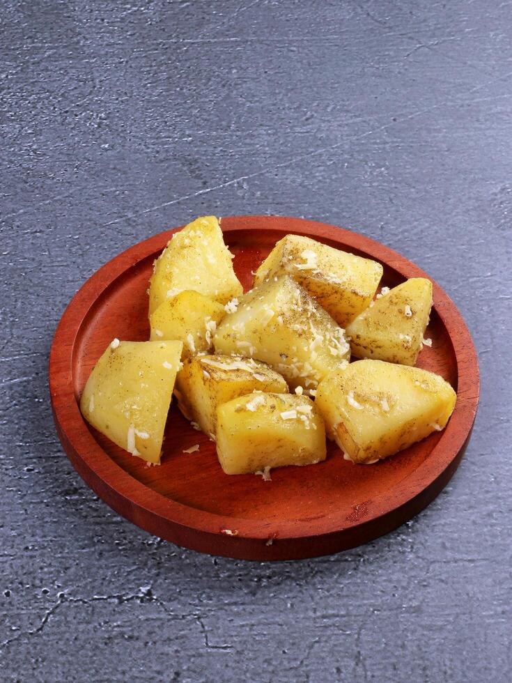 Herb-seasoned boiled potatoes on a plate photo