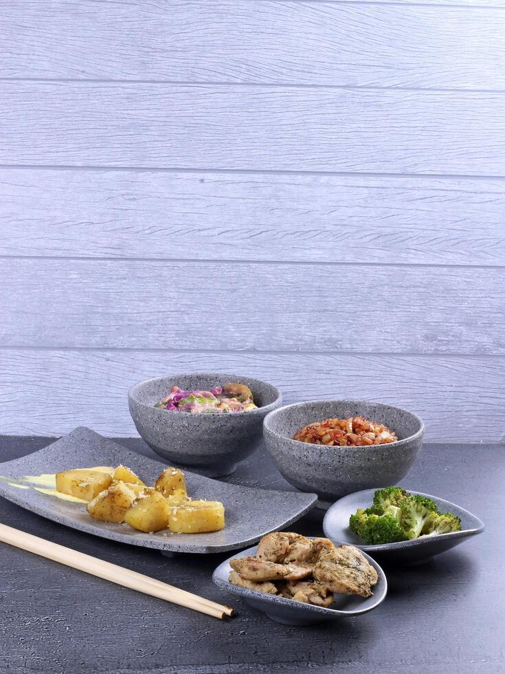 Asian dishes in stoneware bowls photo