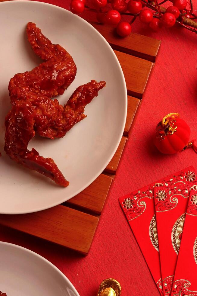 Plate of chicken wings with festive decor photo