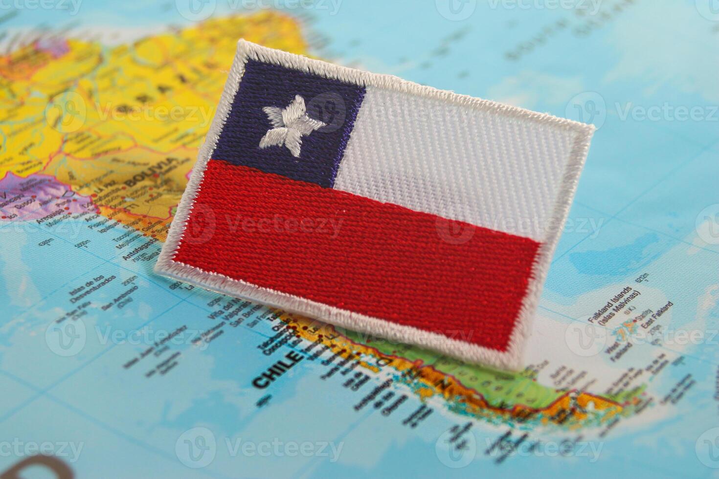 Handmade embroidered Chile flag crafted from eco friendly materials on world map at Santiago. Suited for travel design, cultural identity and sustainability themes photo