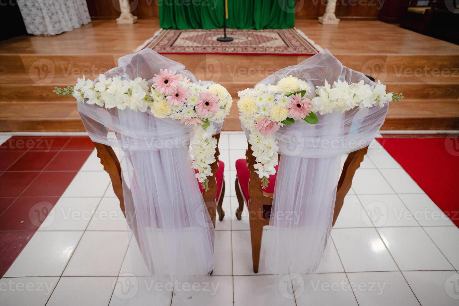 Ceremonial Chairs Decorated with Flowers and Fabrics in a Church, Wedding Ceremony Setting photo