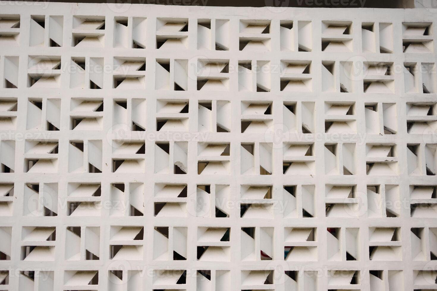 Geometric white wall pattern design with repeating square blocks and interior shadows for photo