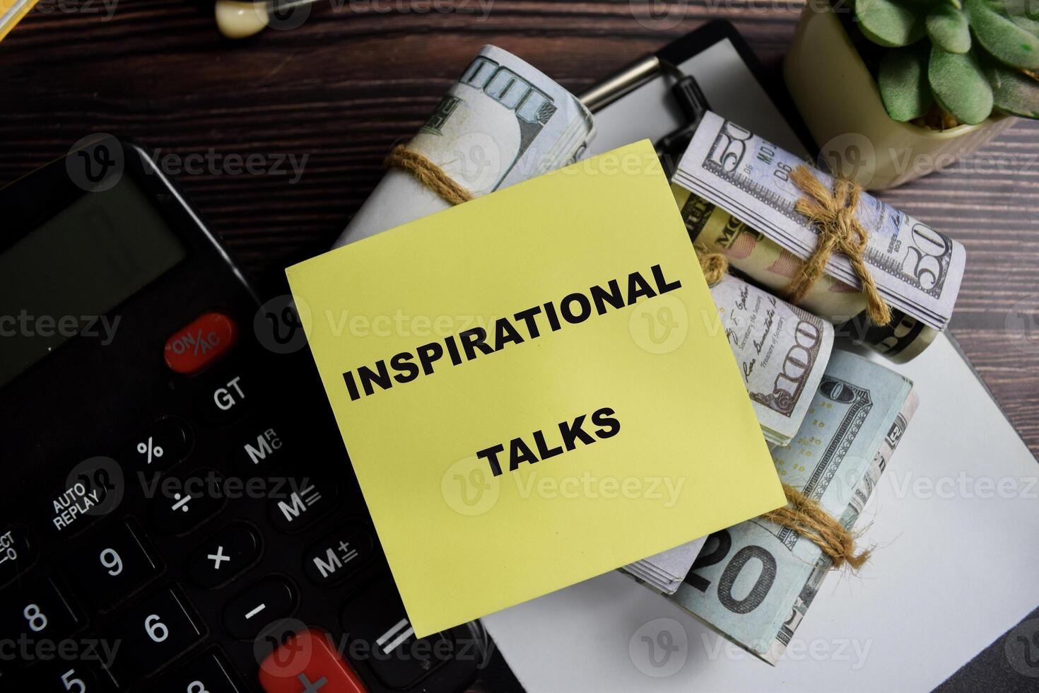 Concept of inspirational talks write on sticky notes isolated on Wooden Table. photo