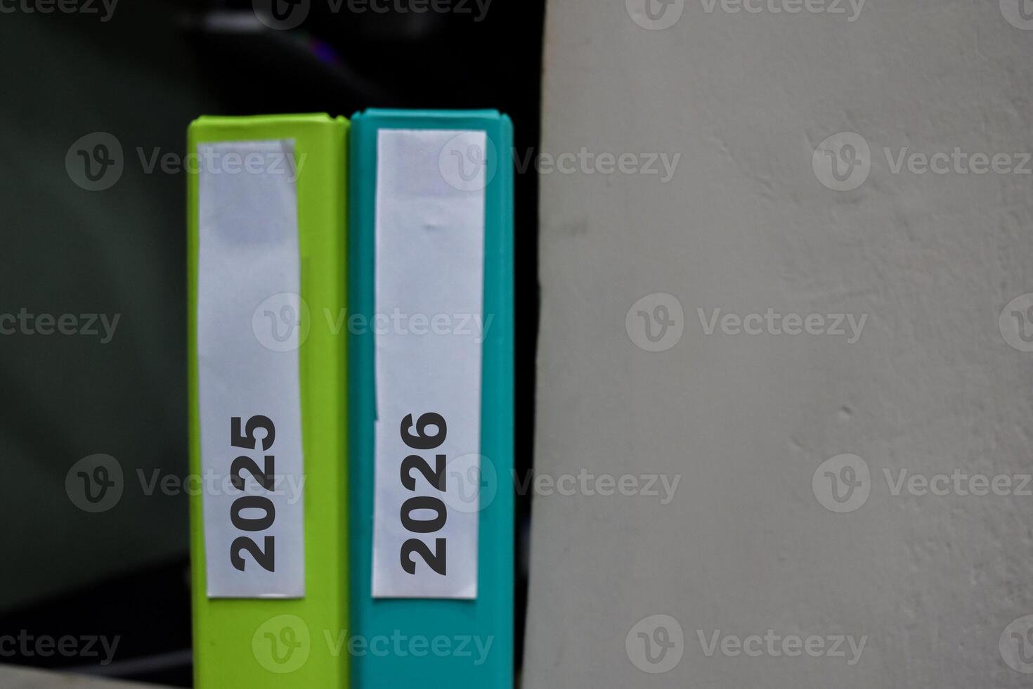 Folders with the label 2025 and 2026. Business management concept photo