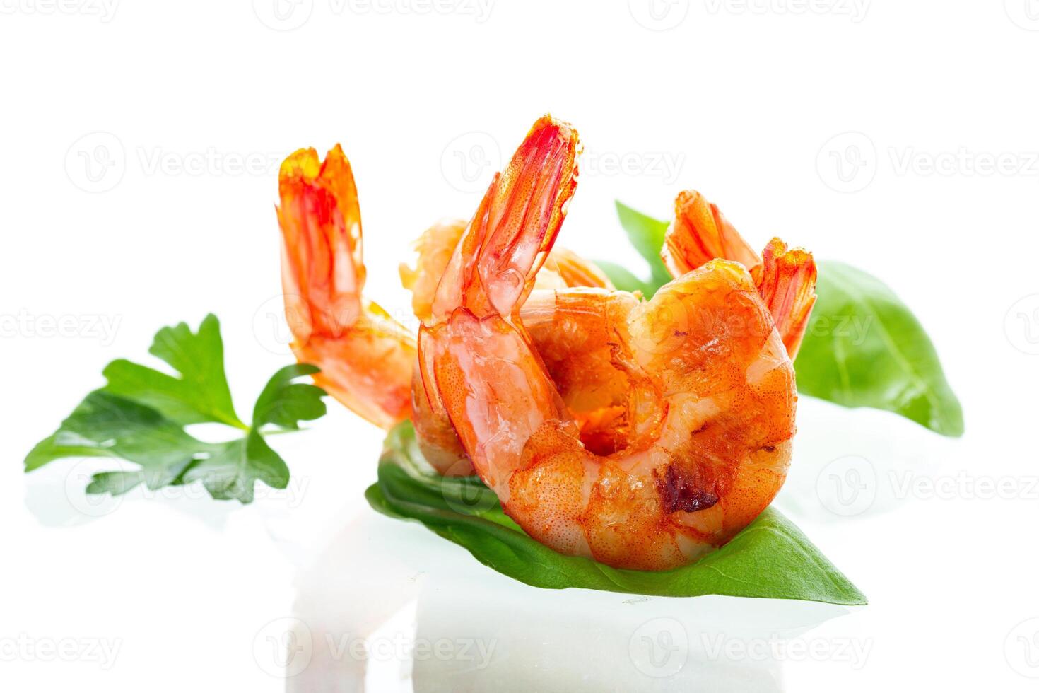 Cooking process of cooking shrimps with lemon isolated on white photo