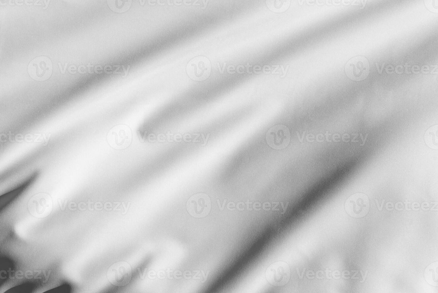 Detailed white flag folds in motion, perfect for textile focused graphics, background layers, or peaceful themed visuals photo