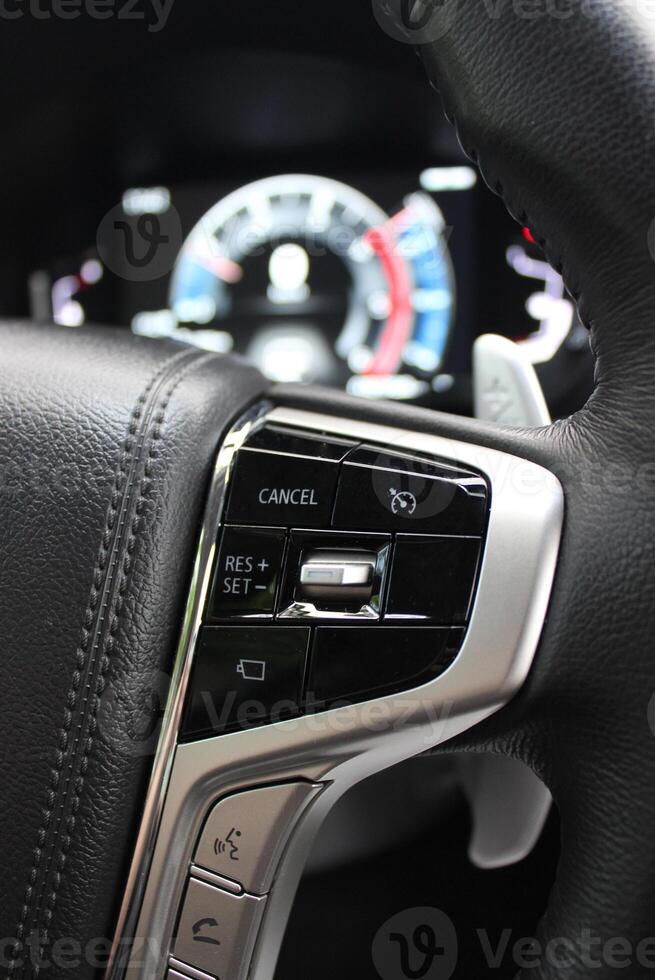 Block of control buttons for vehicle systems on the right side of the steering wheel photo