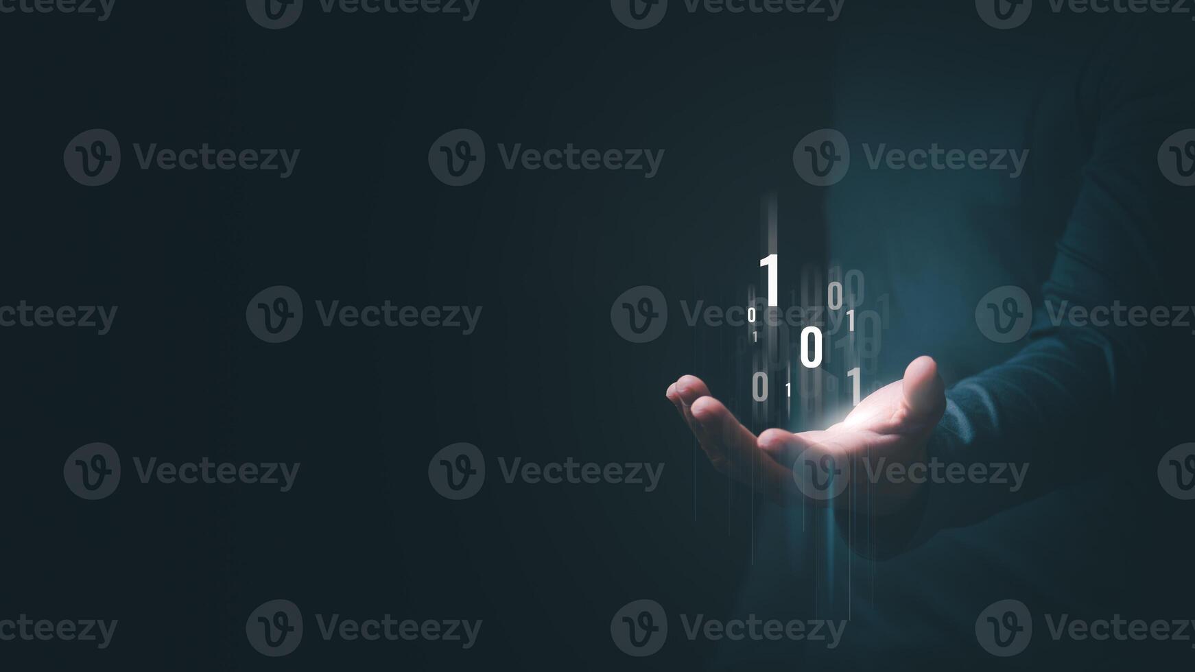 A man's hand shows an abstract virtual binary code hologram to symbolize the unification of control and encryption, protecting against cyber attacks. photo
