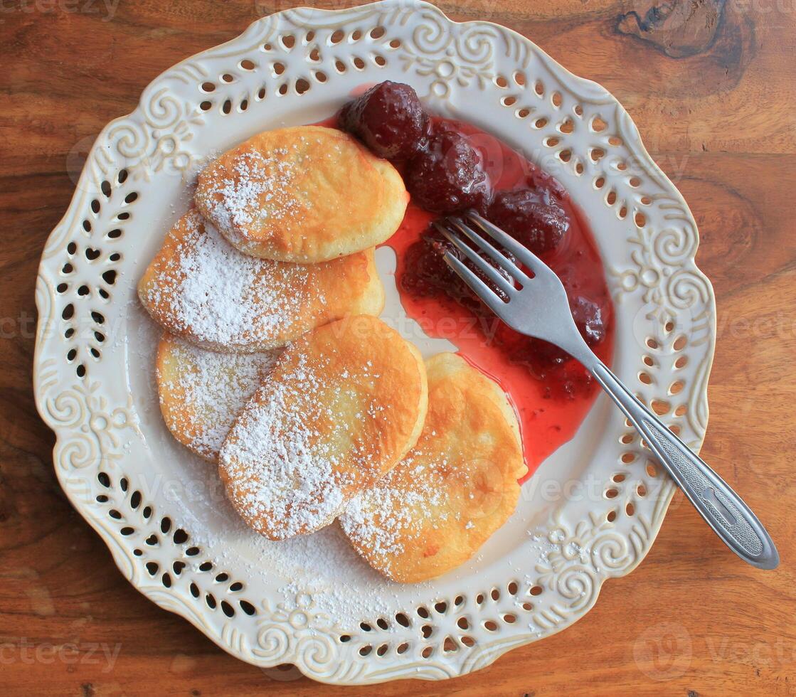 Pancakes with Strawberry Compote and Powdered Sugar photo