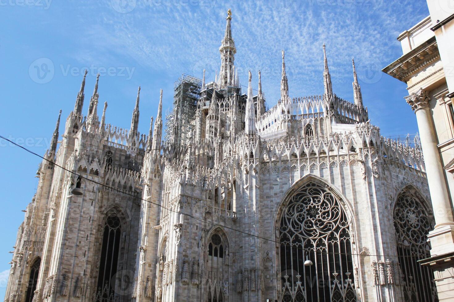 Daytime view of famous Milan Cathedral, Duomo di Milano on piazza in Milan, Italy photo