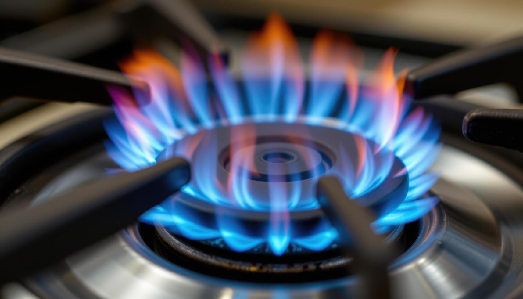 close up view of a blue flame dancing lightly over a gas burner, its heat creating ripples of distortion in the surrounding air. photo