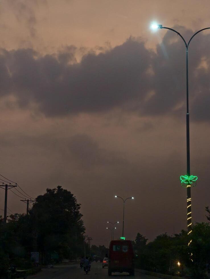 Evening street view with cloudy sky and street lights scenic landscape urban photography road trip travel photo