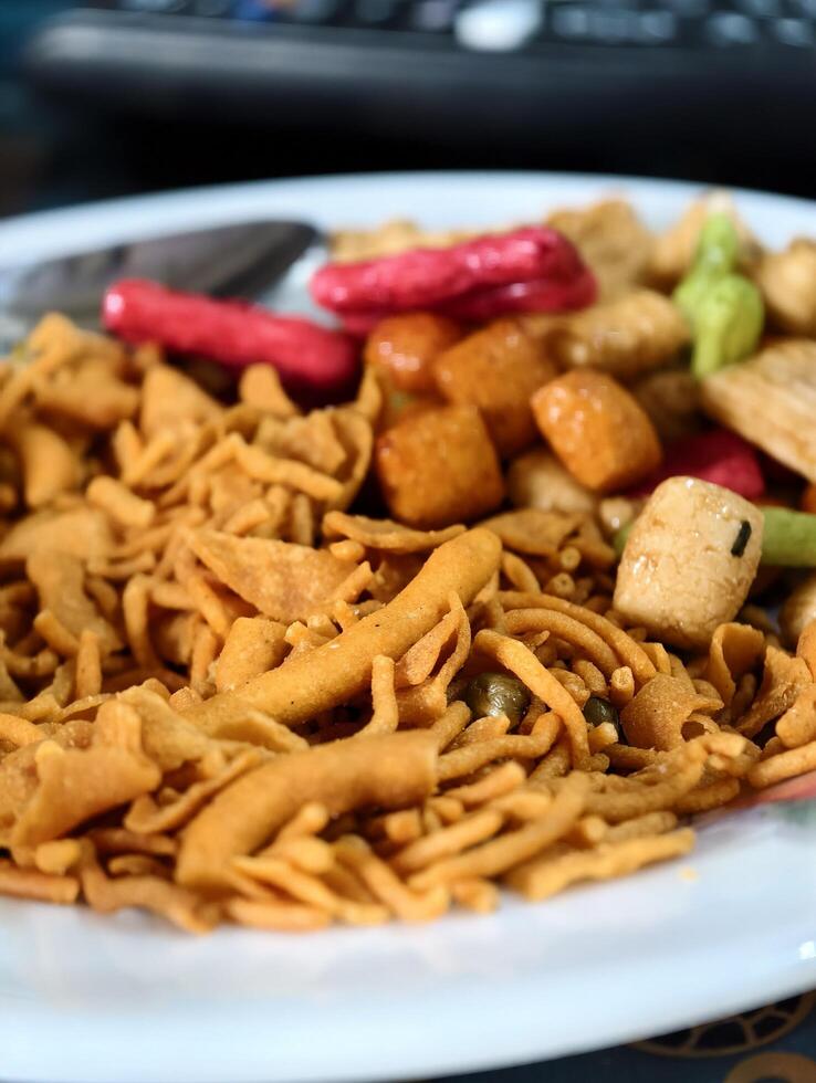 Delicious indian snack mixture chanachur recipe sev fried spicy food on plate tasty and flavorful treat photo