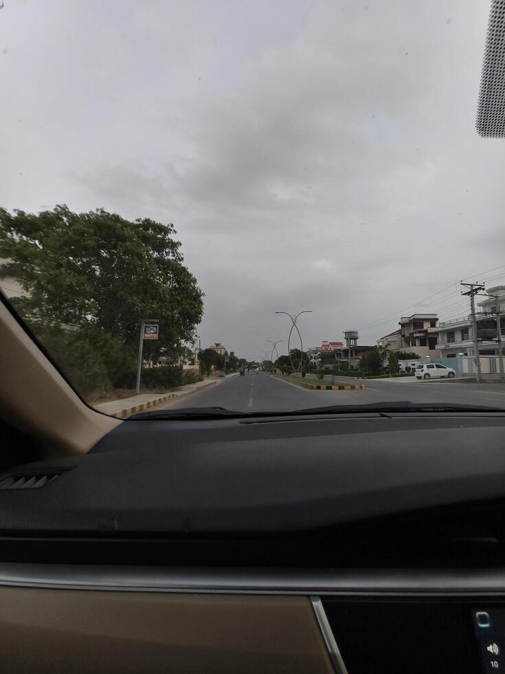 Driving view road trip scenic route car interior dashboard travel destination cloudy sky journey adventure photo