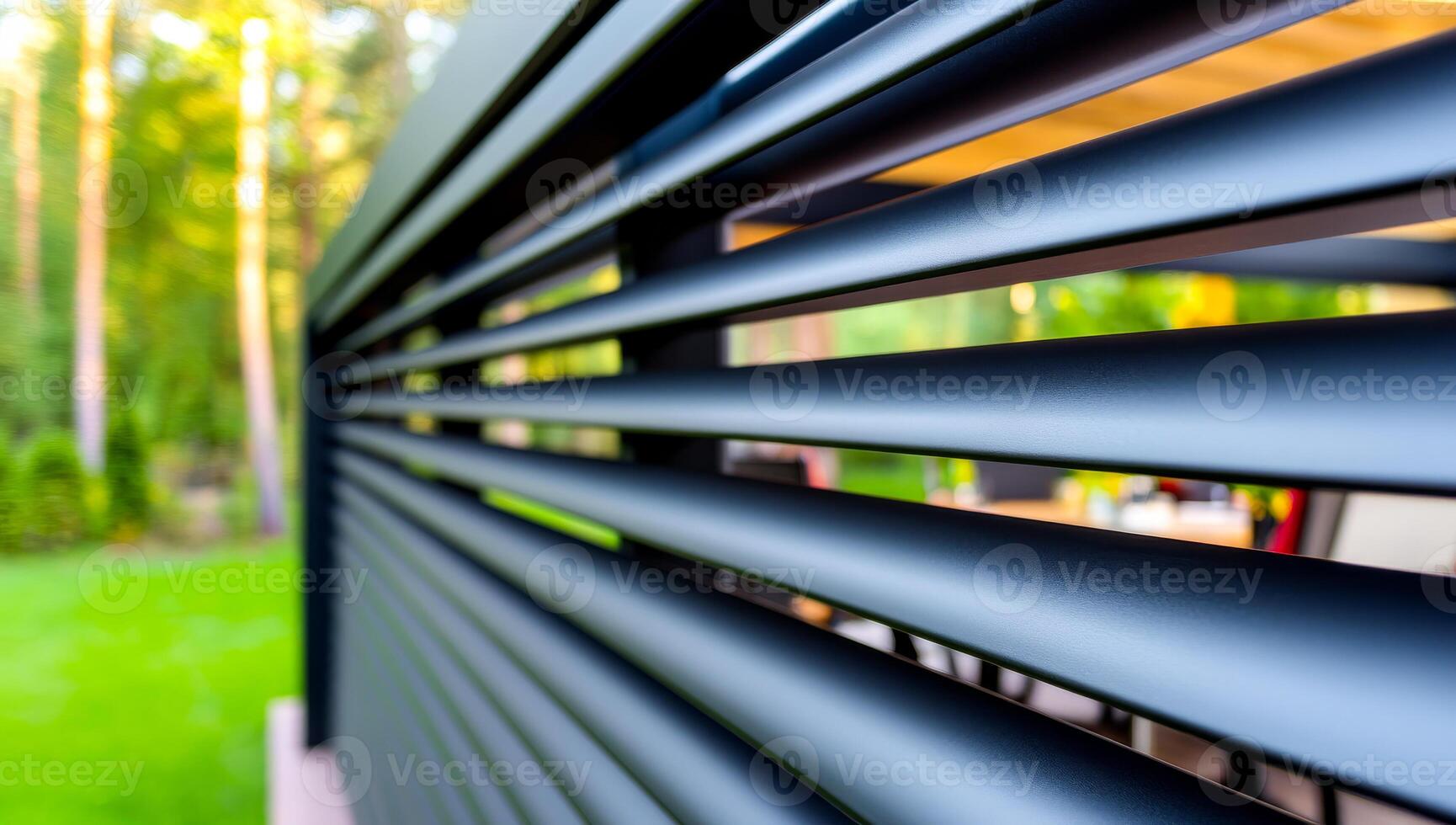 Modern outdoor space with sleek design. Close-up view of stylish slatted exterior featuring a contemporary outdoor living area surrounded by trees. photo