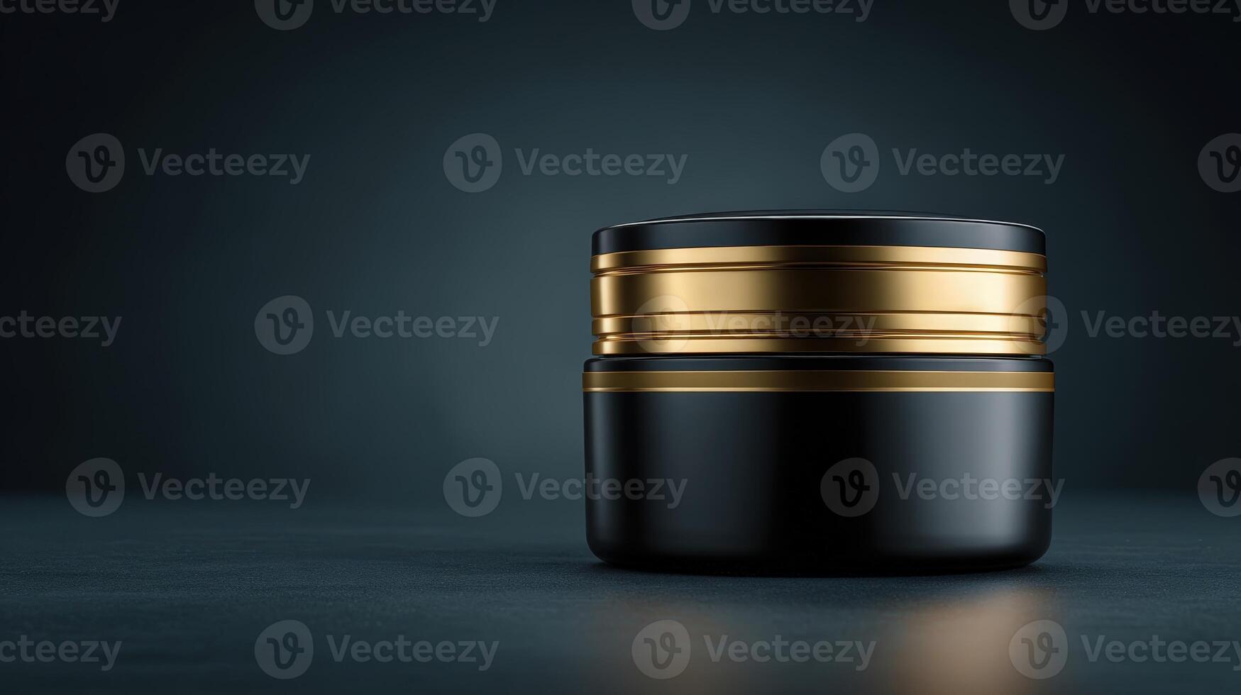 Sleek black eye cream container designed with elegant gold accents for luxurious skincare routine photo