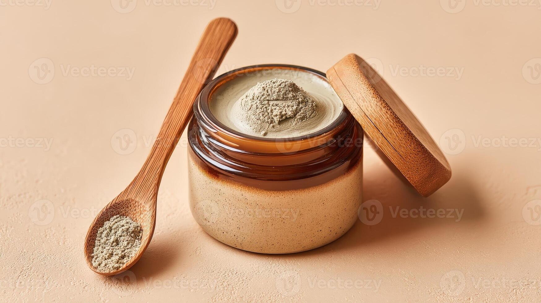 Natural face mask in a jar with wooden spoon on off white surface for skincare routine photo