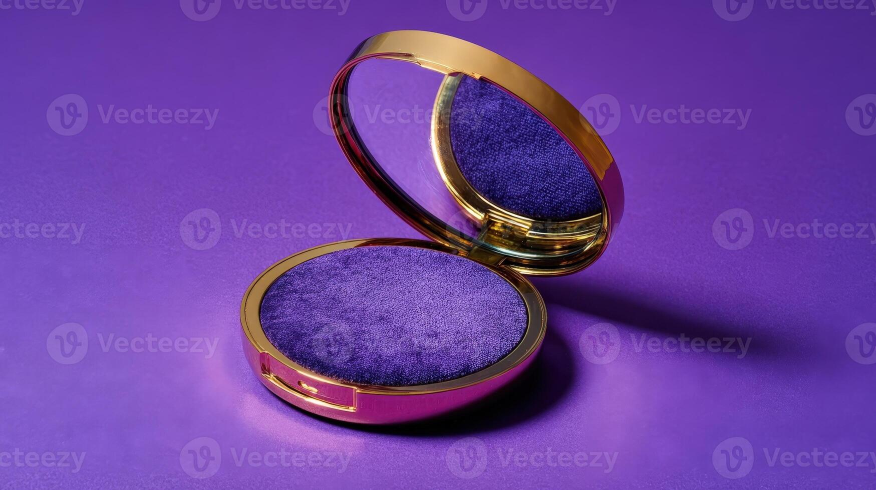 Closed compact mirror with vibrant purple interior set against a striking purple backdrop showcasing elegance and style photo