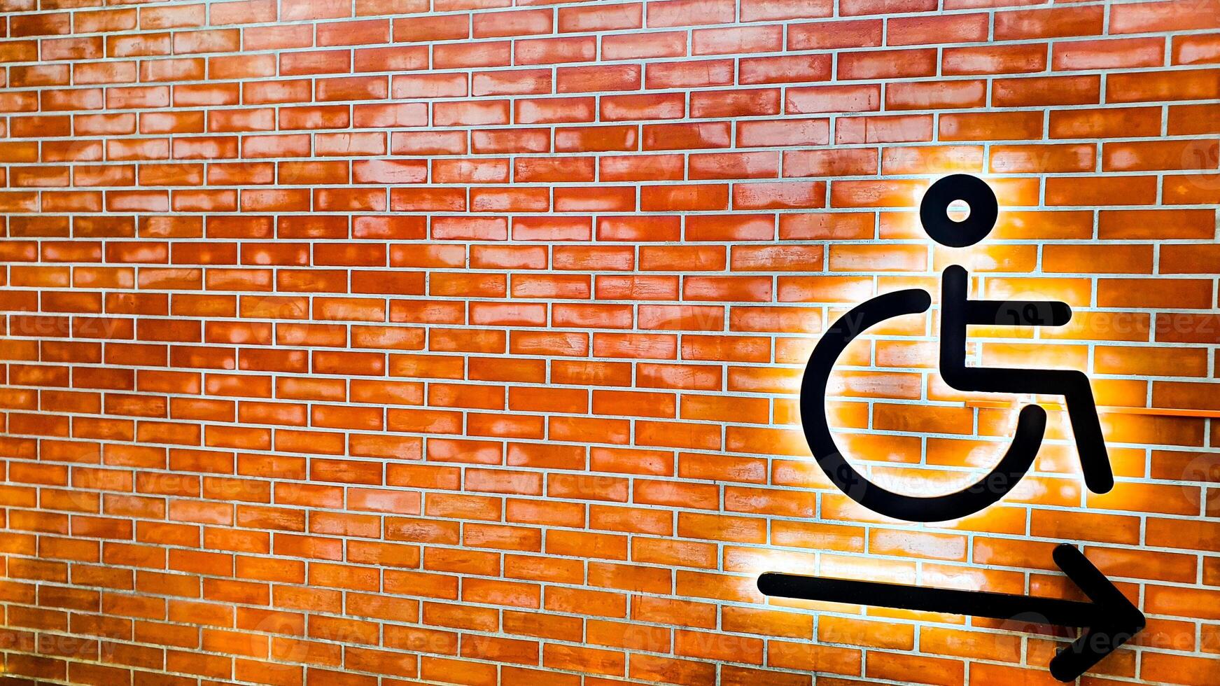 Red bricks lined up symbolizing disabled people in wheelchairs photo