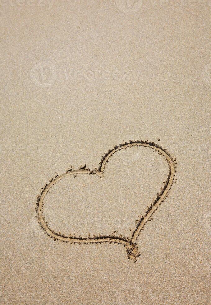 heart on sea sand photo