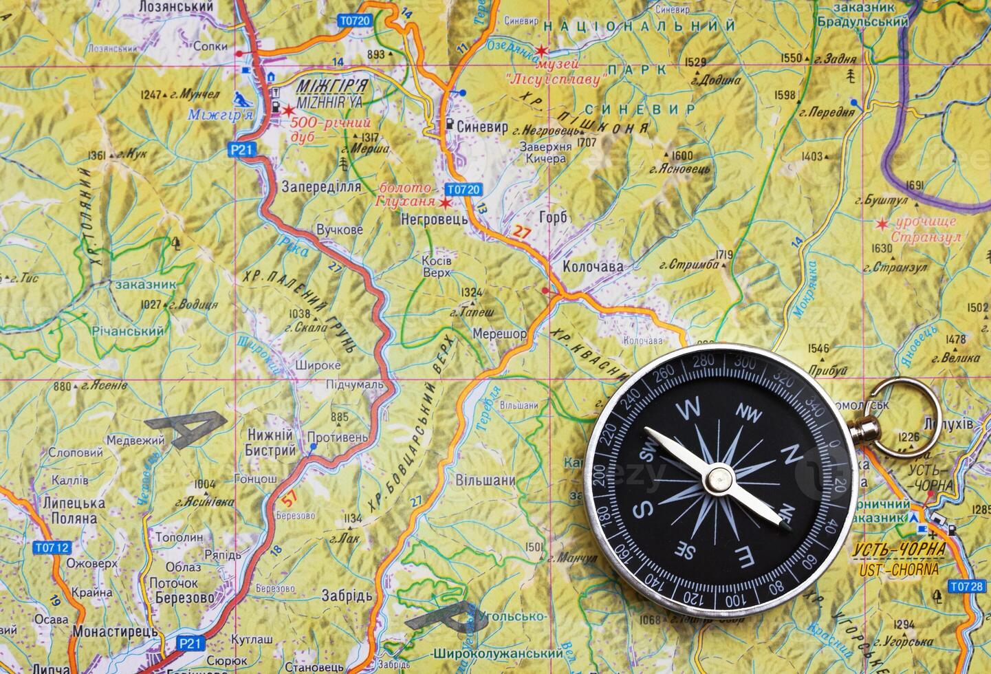 Compass on a map close photo