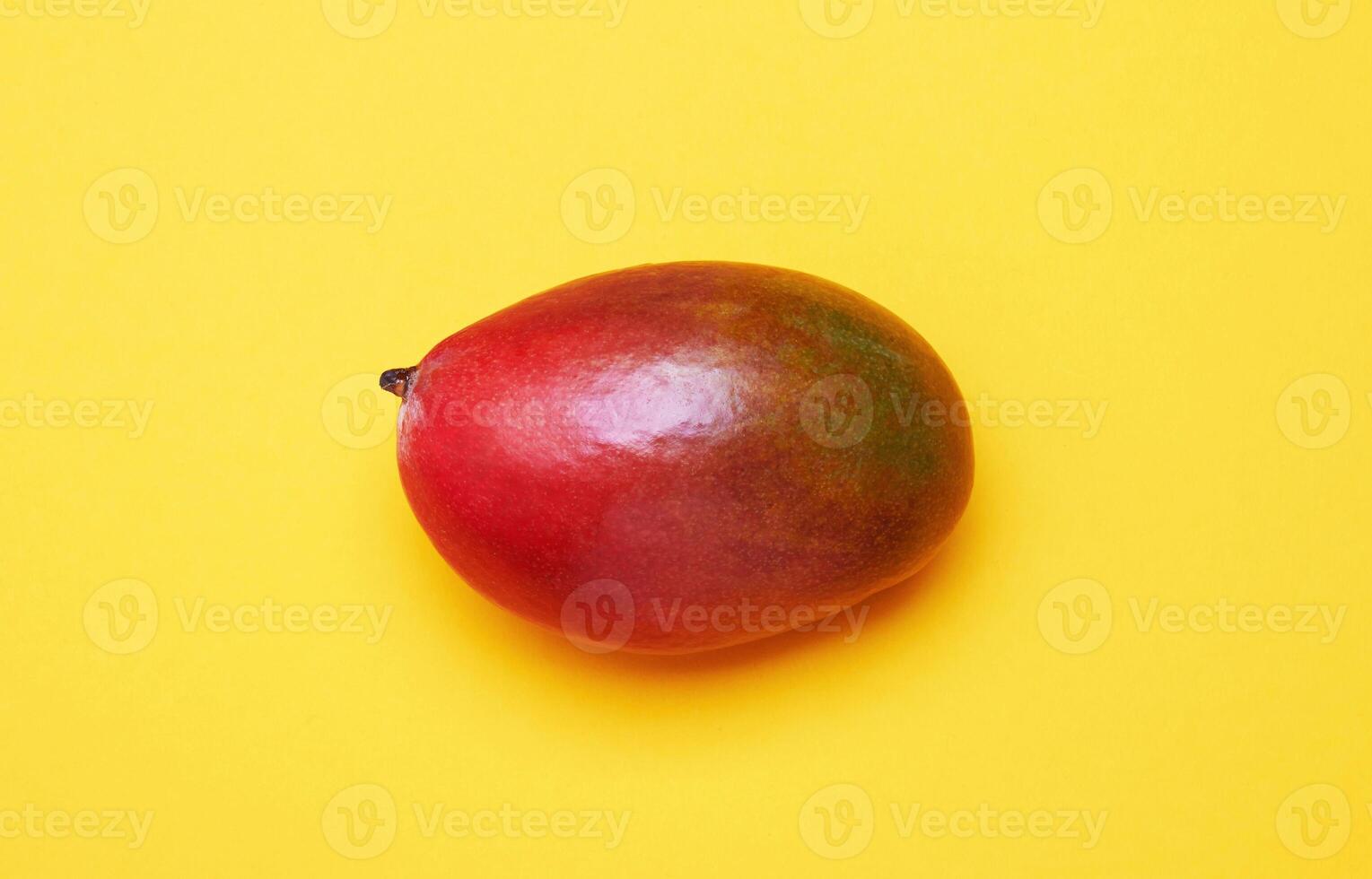 Mango on a yellow photo