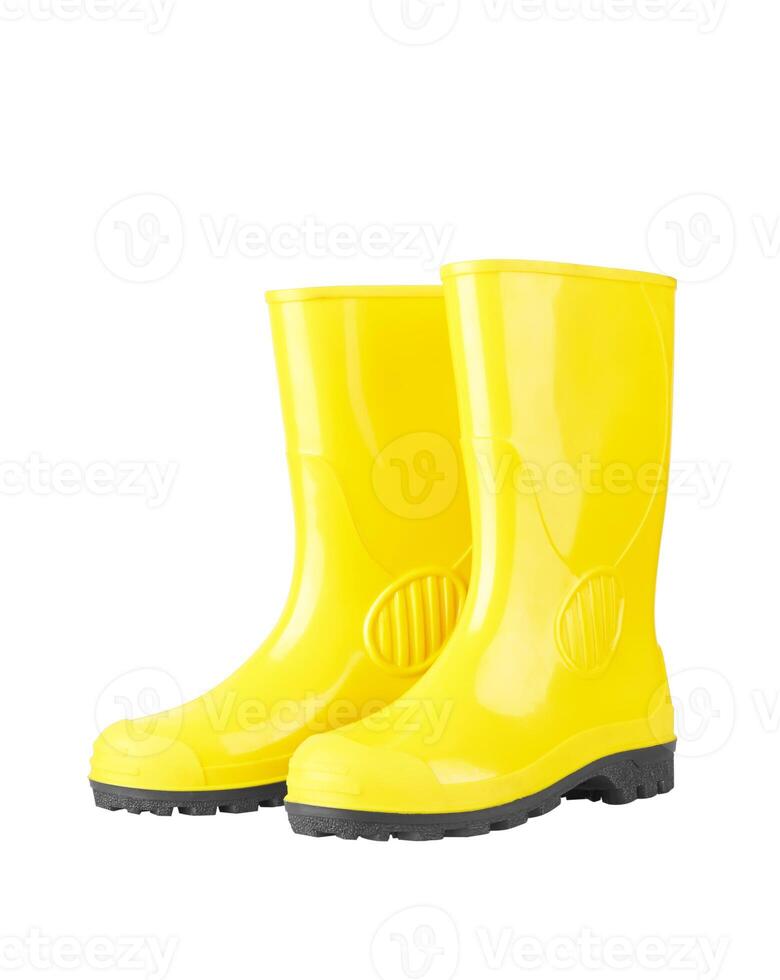 Yellow rubber boots on white photo