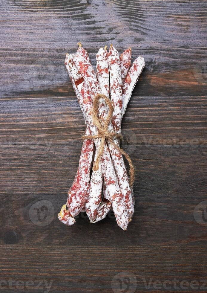 Salami sausages on a wood photo