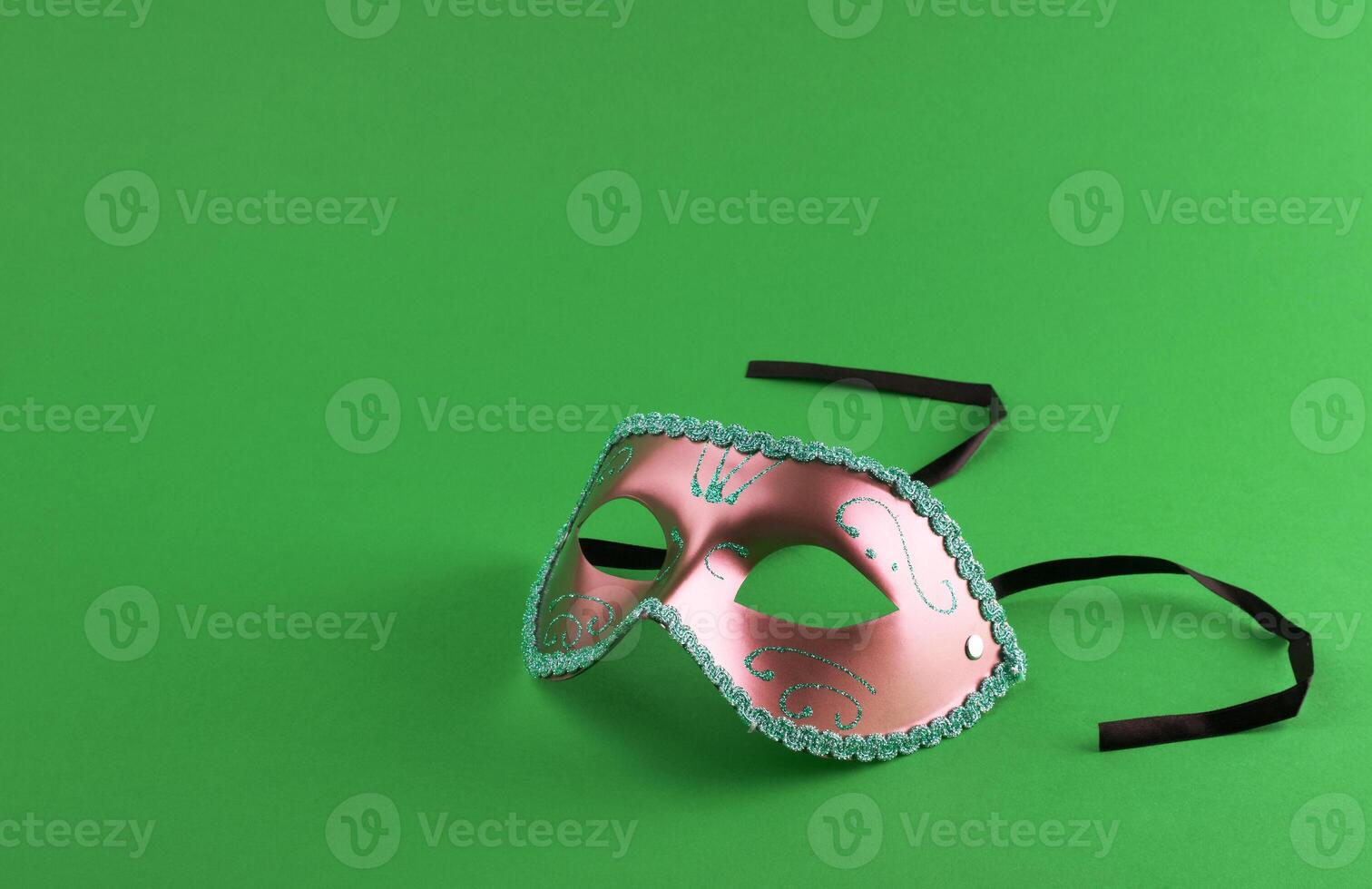 Carnival mask on green photo