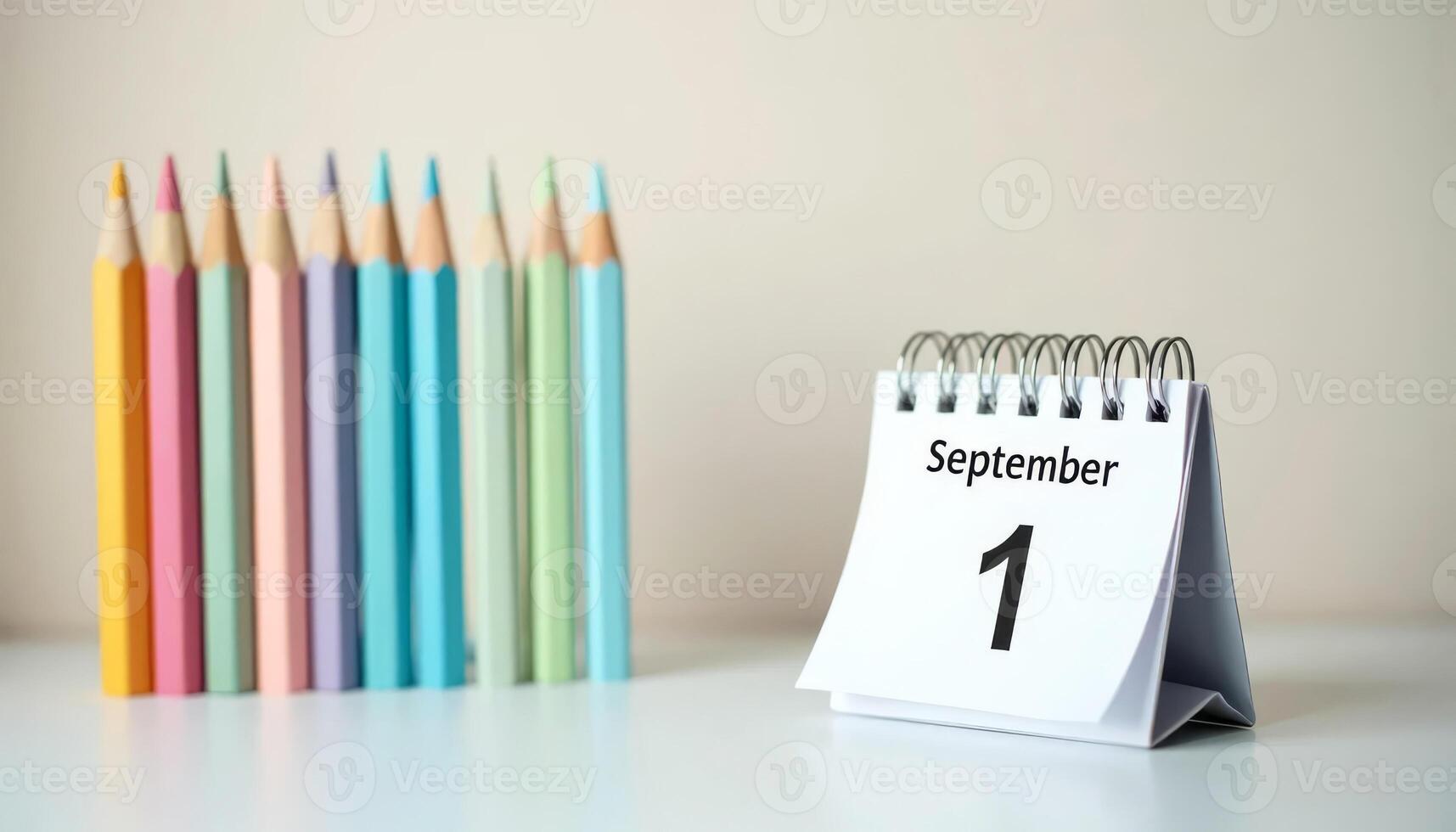 September 1 calendar and pastel pencils on desk. First day of school, new academic year, learning start. photo