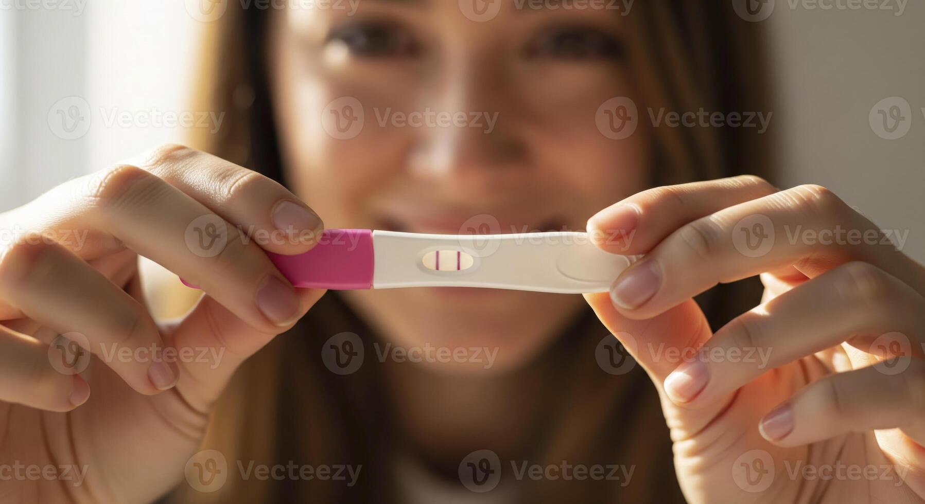 Woman holding a positive pregnancy test, smiling in the background. Hope, new life, and family planning. photo