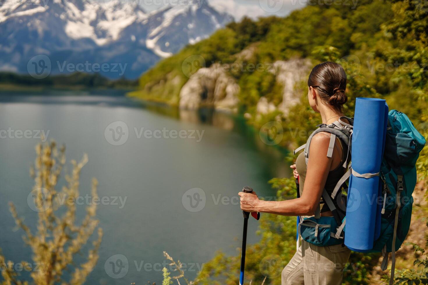 Hiker enjoying mountain landscape view photo