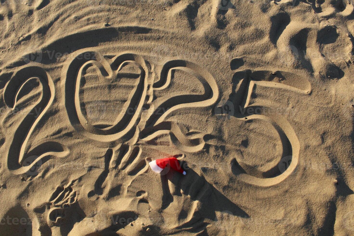 2025 New Year Written in the Sand with the Heart Symbol photo