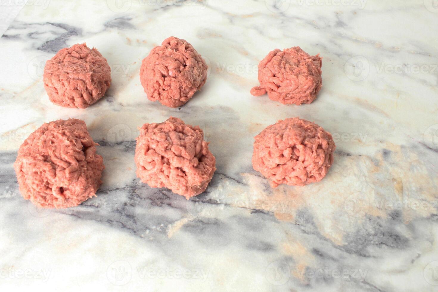 meatballs meat balls lying on a light background, close-up. Cooking meatballs photo