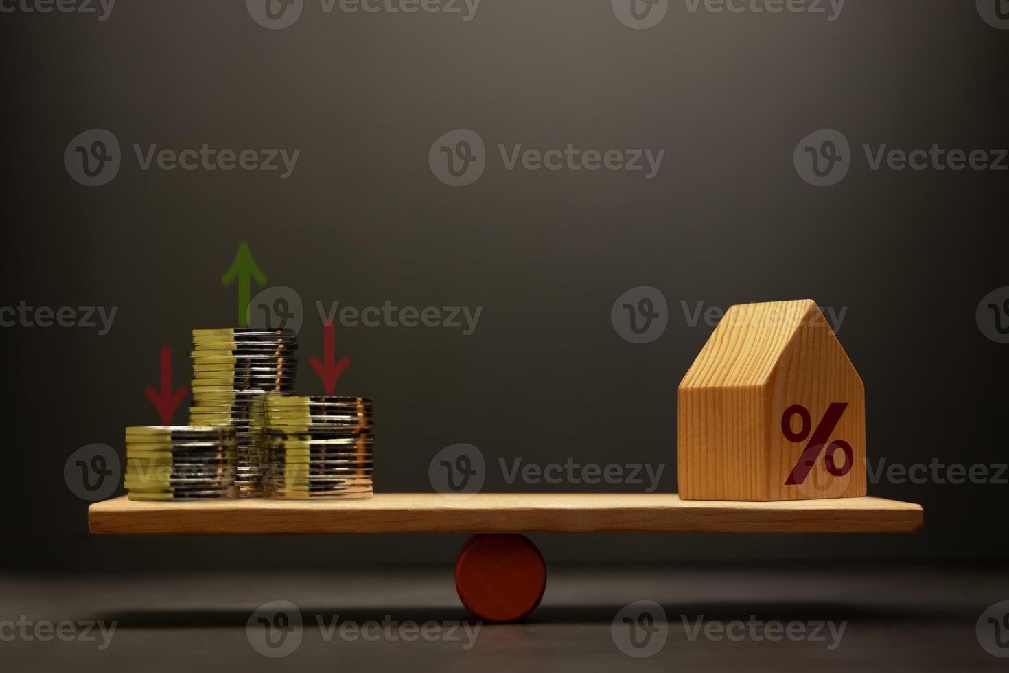 Stacked coins money and houses balanced on a scale seesaw. Mortgage interest rates, House Loan and real estate investment photo