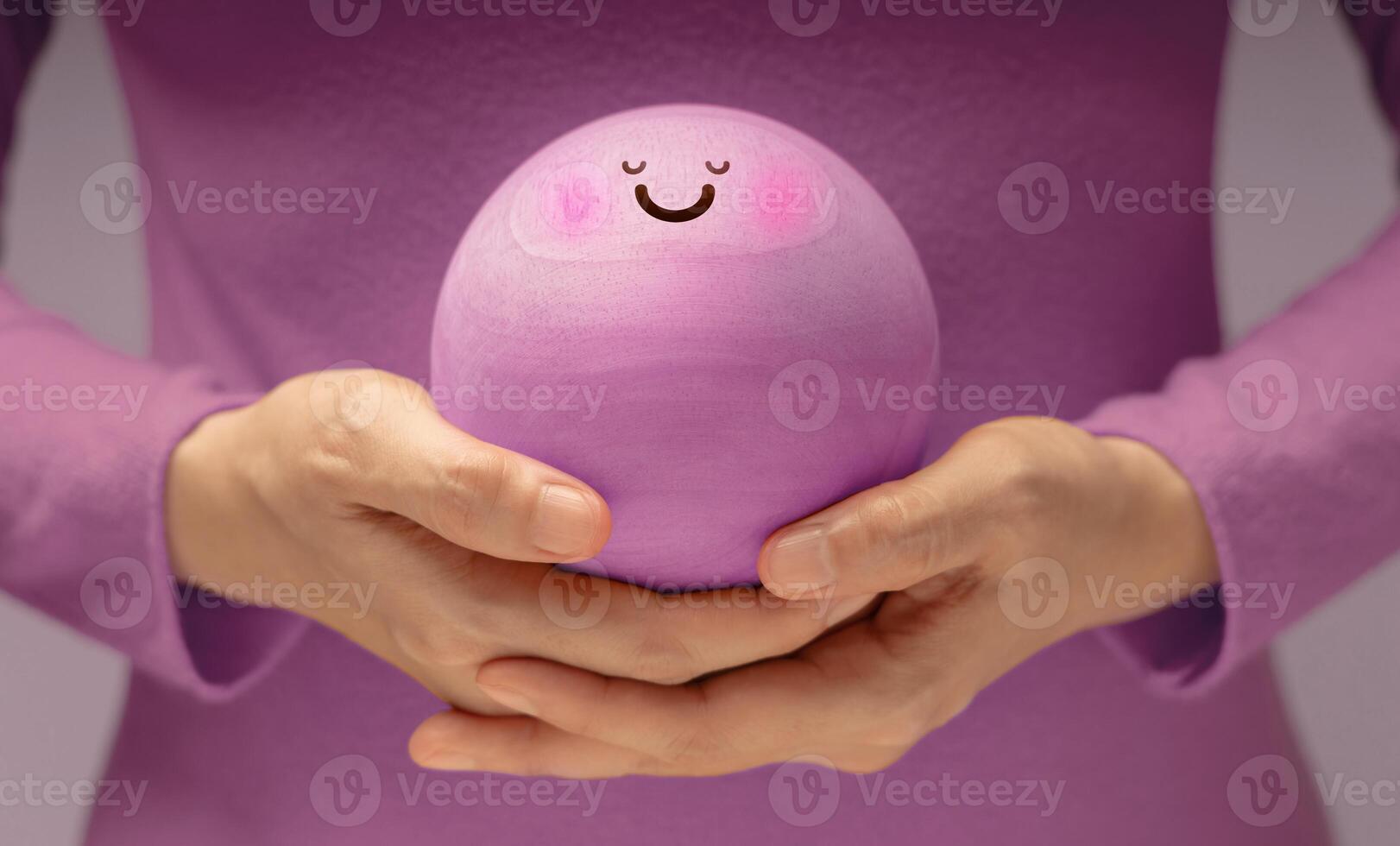 Hands gently holding Smiling Circle face. Mental health, emotional balance,inner peace through meditation and mindfulness. symbolizing good mental and self-awareness photo