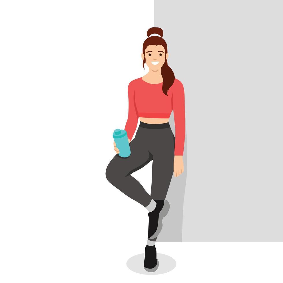Young woman in athletic wear leans casually against a wall, smiling with a water bottle in hand. vector