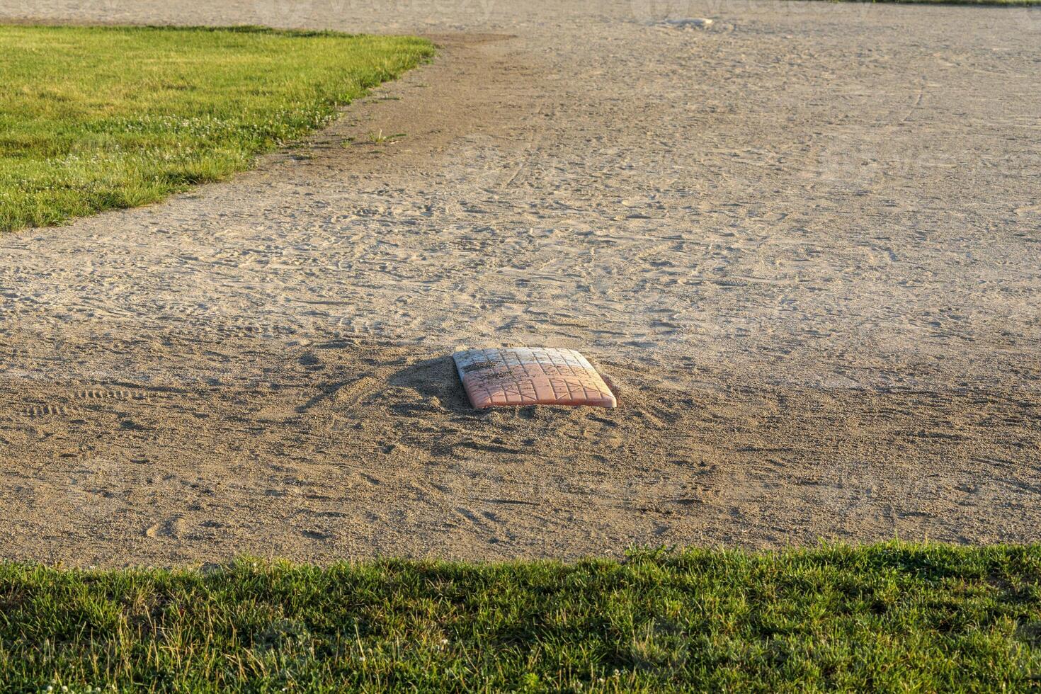 close up of first base on diamond two in the park photo