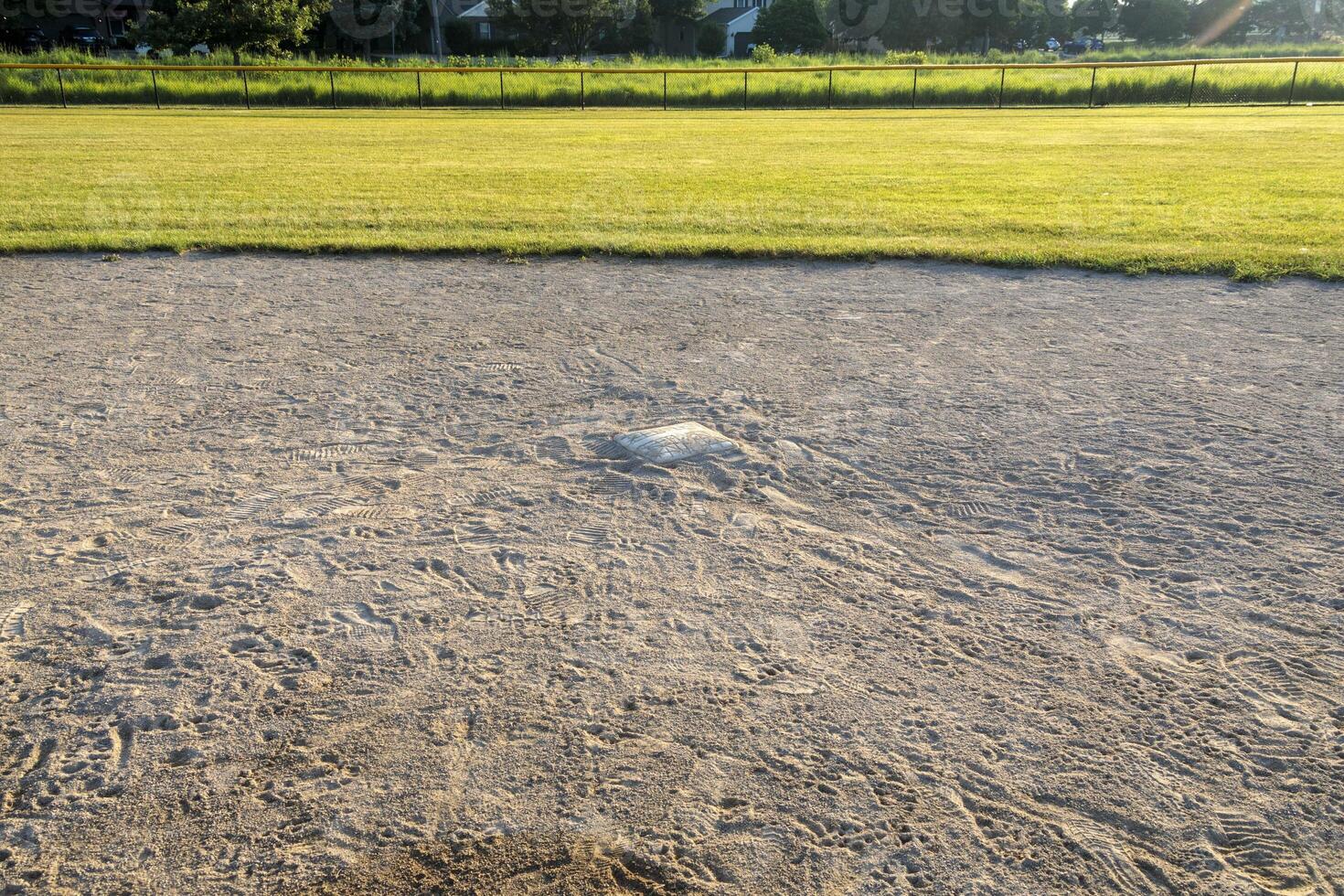 close up of second base on diamond two in the park photo
