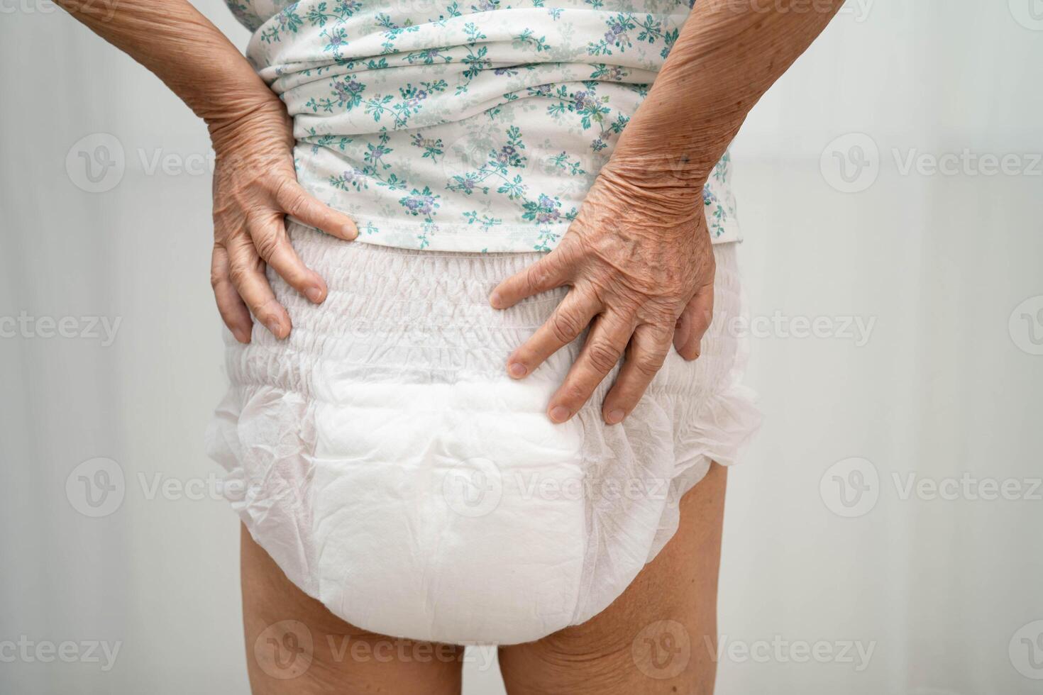 woman patient wearing adult incontinence diaper pad photo