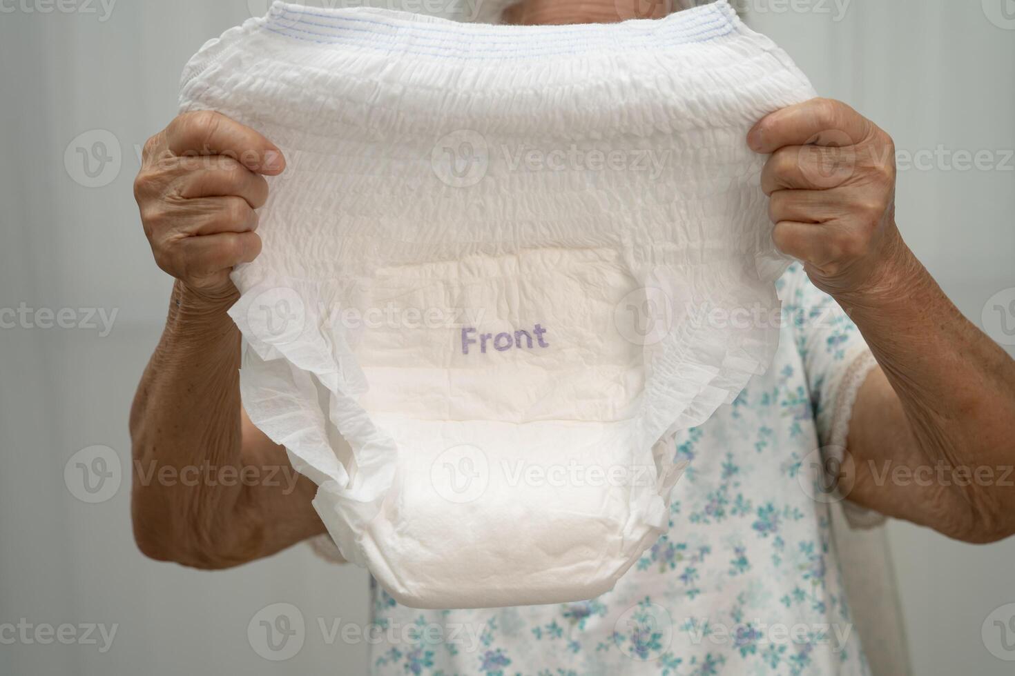 senior woman patient adult incontinence diaper pad photo