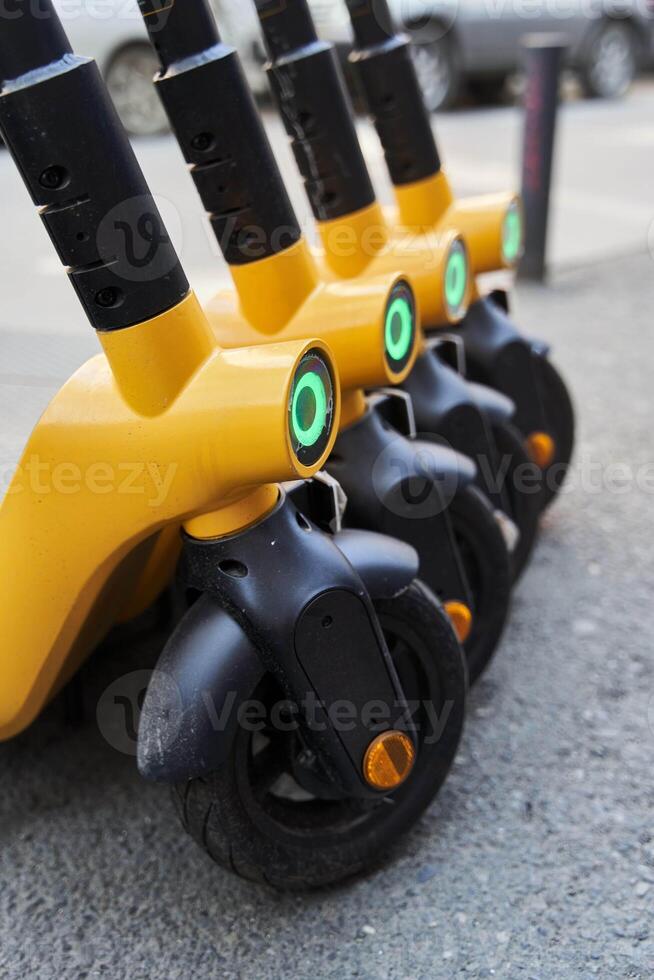 Electric scooters for rental . Vehicle rent service background. Electric kick scooters for transportation photo