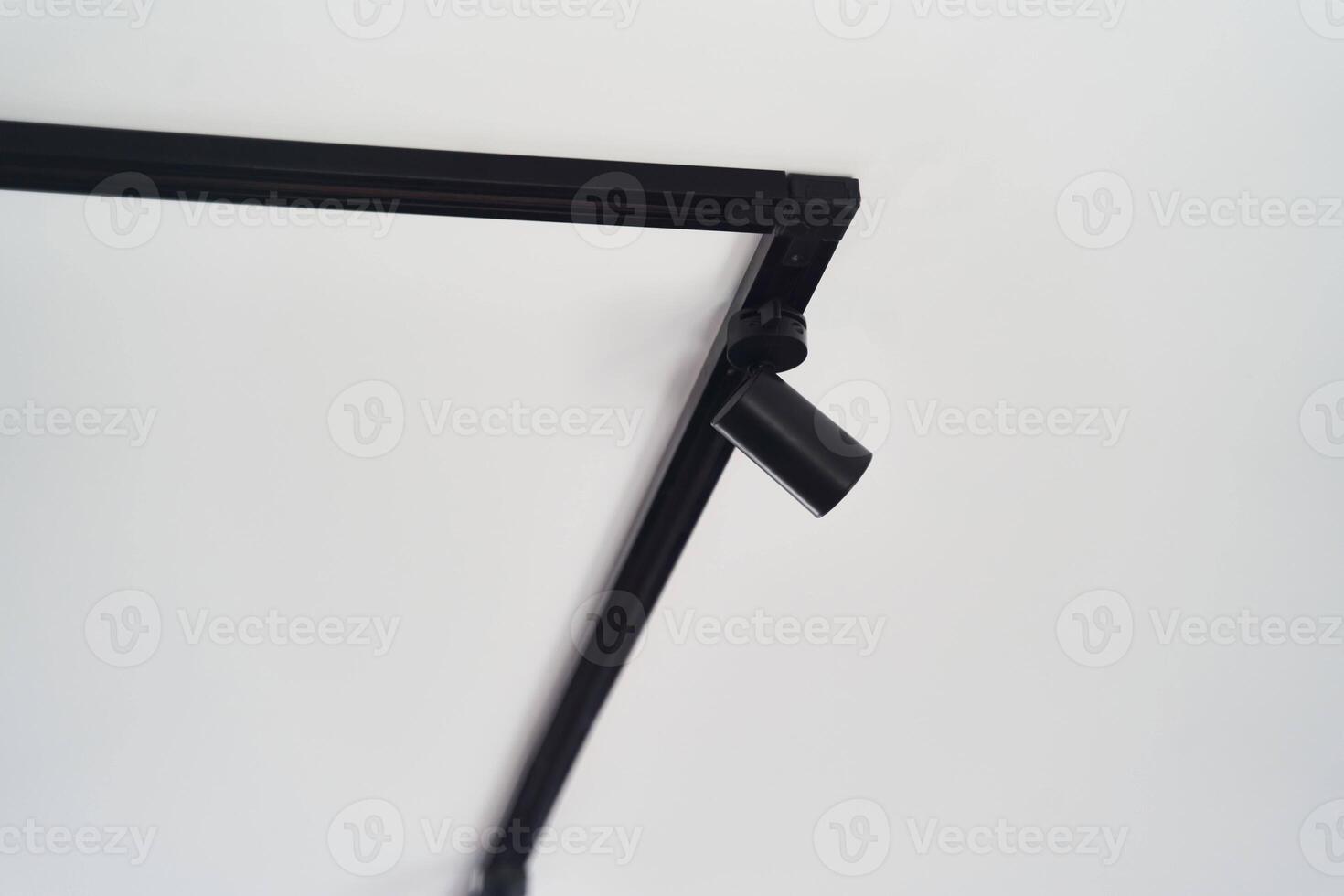 Modern LED black track lights in the interior photo