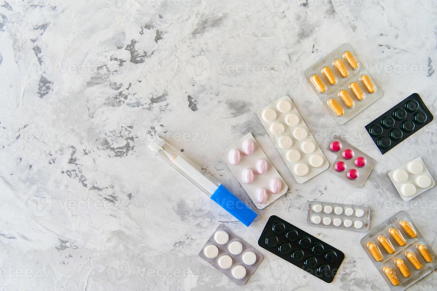 Pills capsules medicine health on light background, top view photo